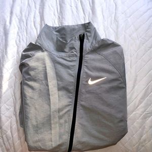 Nike running windbreaker used a handful of times. Lightweight and cute.